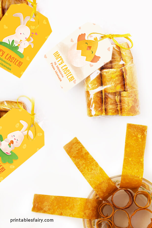 Bags of mango fruit leather with yellow Happy Easter tags