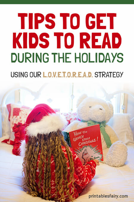 Kid with a Christmas hat reading to a teddy bear