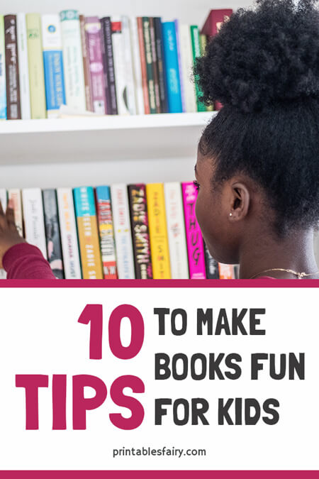 Young girl picking a book from a book stand