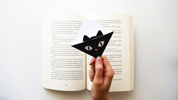 Black Cat Bookmark inside a book