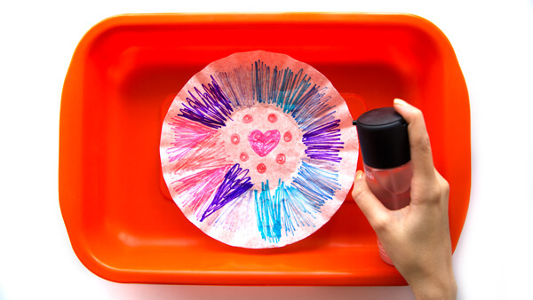 Spraying the coffee filters with water