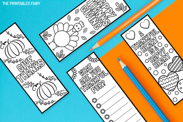 Thanksgiving Coloring Bookmarks on an orange and blue table