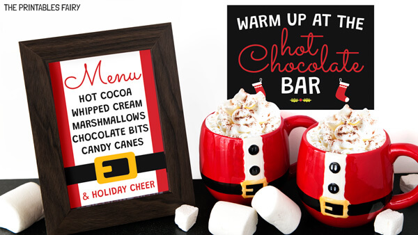 Hot Cocoa Signs next to 2 chocolate mugs