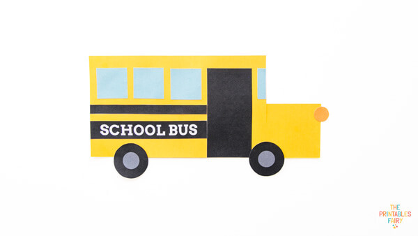 Add the small orange circle to complete your shape school bus craft