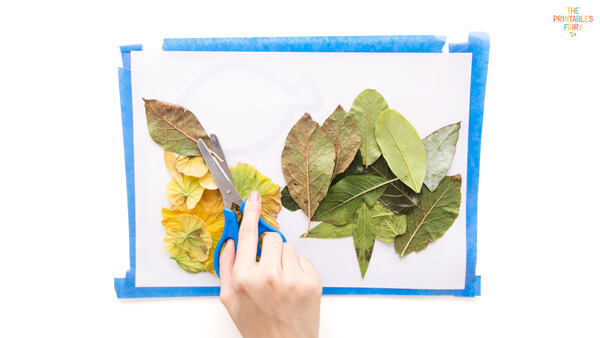 Cutting the stems for a leave already pasted in the contact paper