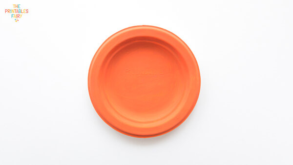 Paper plate painted orange