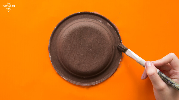 Painting the paper plate brown