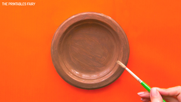 Painting the paper plate brown