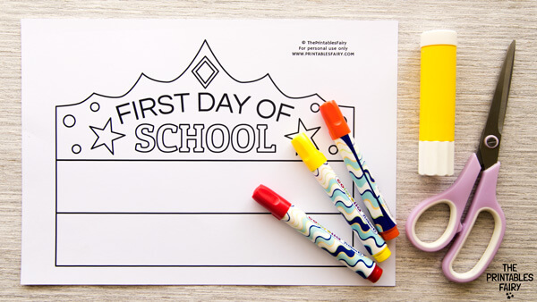 White table with the First day of school crown template, markers, glue, and scissors