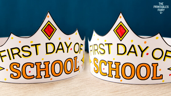 First Day of School Crowns on a white table and a blue background
